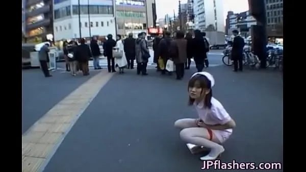 XXX Naughty Asian girl is pissing in public cool Movies